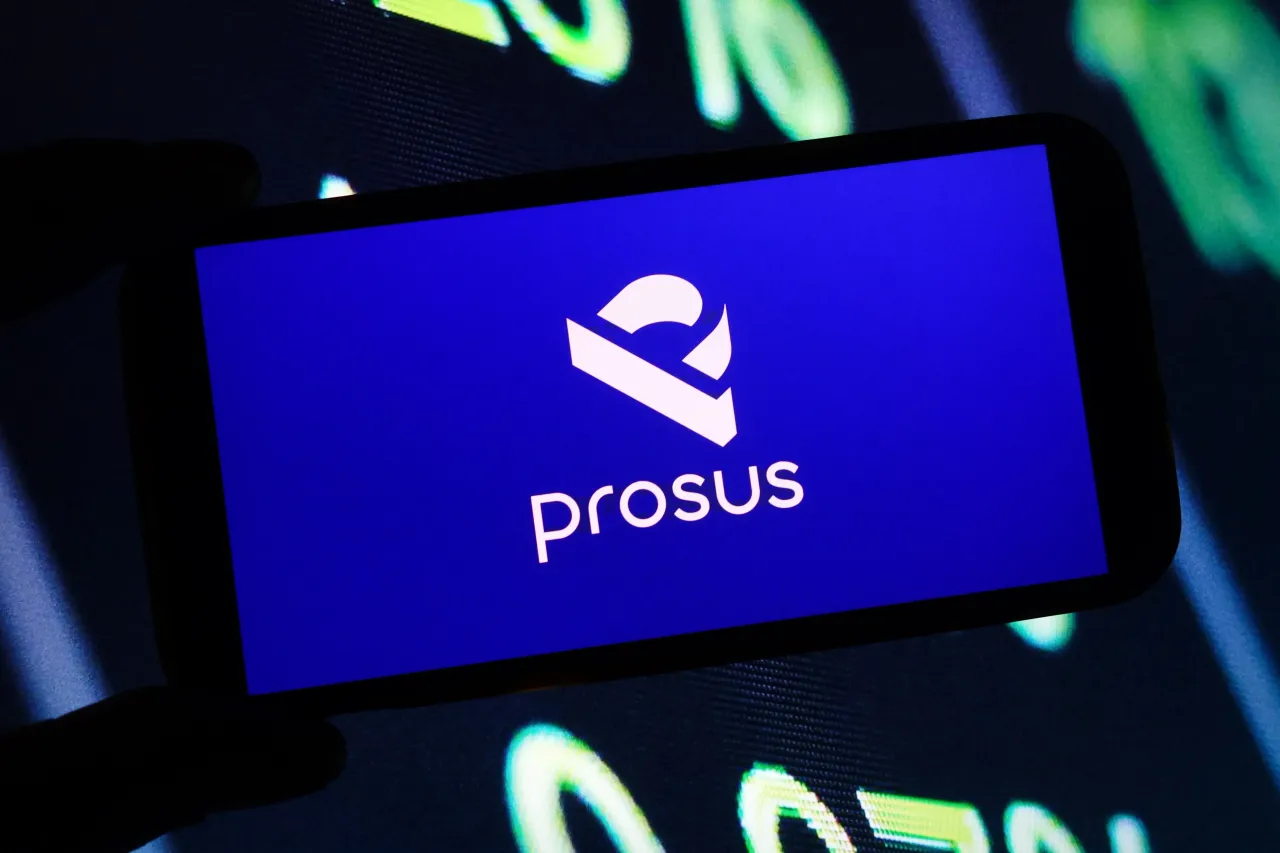 In this photo illustration, the Prosus company logo is seen displayed on a smartphone screen