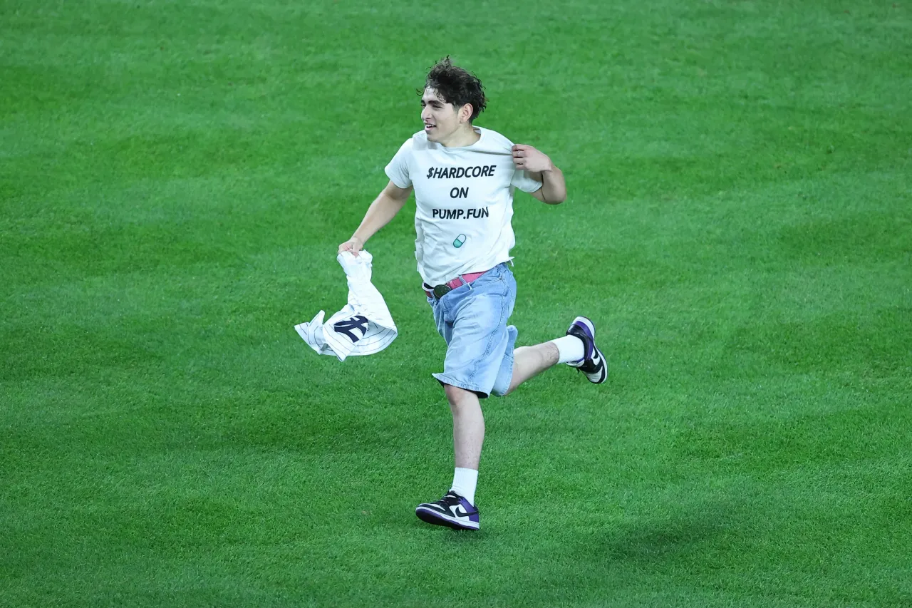 A person wearing Pump.Fun t-shirt runs on the field during the ALDS Game 3 between the New York Yankees and Toronto Blue Jays on October 7, 2025 at Yankee Stadium in the Bronx, New York. (Photo by Rich Graessle/Icon Sportswire via Getty Images)