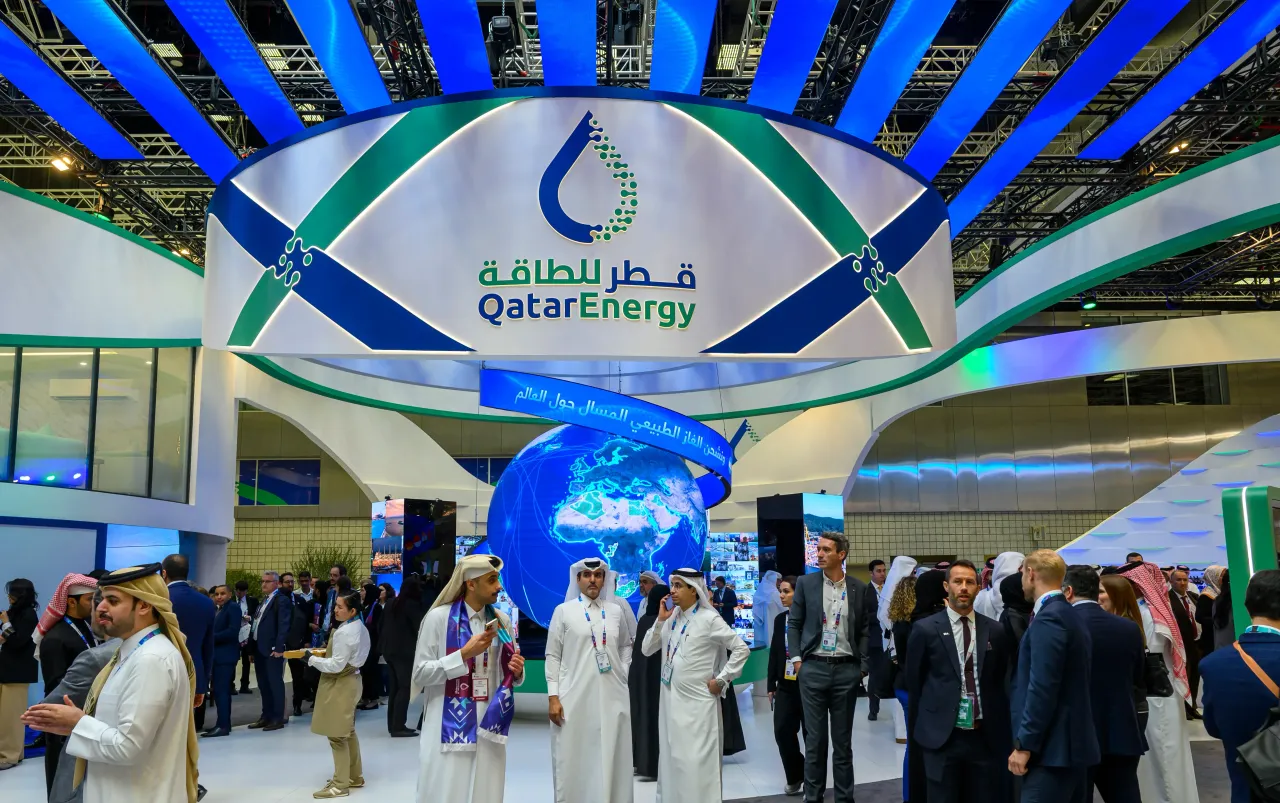Delegates visit the Qatar Energy exhibition stand at the 21st International Conference and Exhibition on Liquefied Natural Gas at the Qatar National Convention Centre