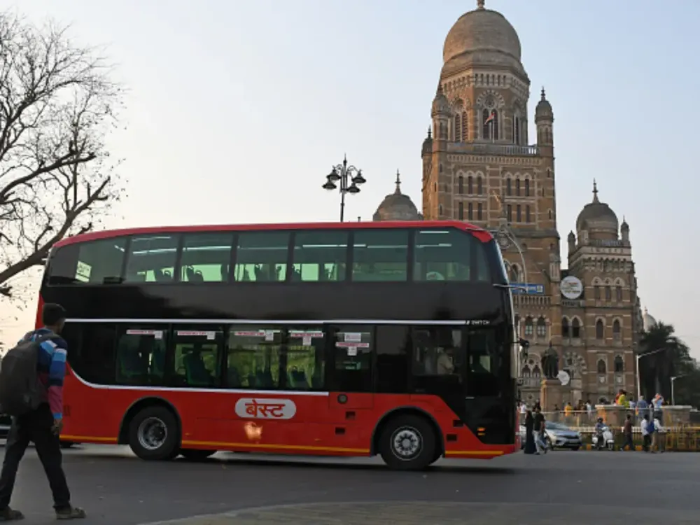 An airconditioned electric double decker bus drives by Brihanmumbai Municipal Corporation (BMC) building in Mumbai. (Photo by Ashish Vaishnav/SOPA Images/LightRocket via Getty Images)