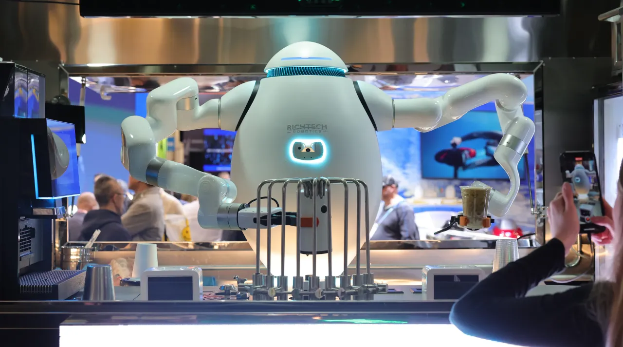 ADAM, an interactive robot bartender, barista and chef, makes drinks for attendees at the Richtech Robotics booth during CES 2024 at the Las Vegas Convention Center on January 10, 2024 in Las Vegas, Nevada