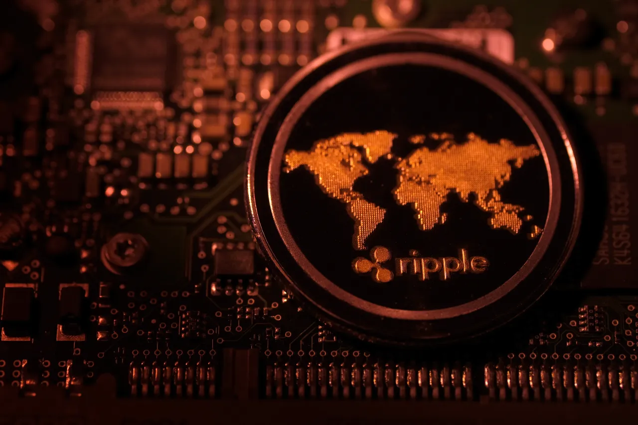 : In this photo illustration, a visual representation of digital cryptocurrency Ripple (XRP) is arranged on a circuit board of a hard drive on January 3, 2021 in Katwijk, Netherlands. (Photo by Yuriko Nakao/Getty Images)