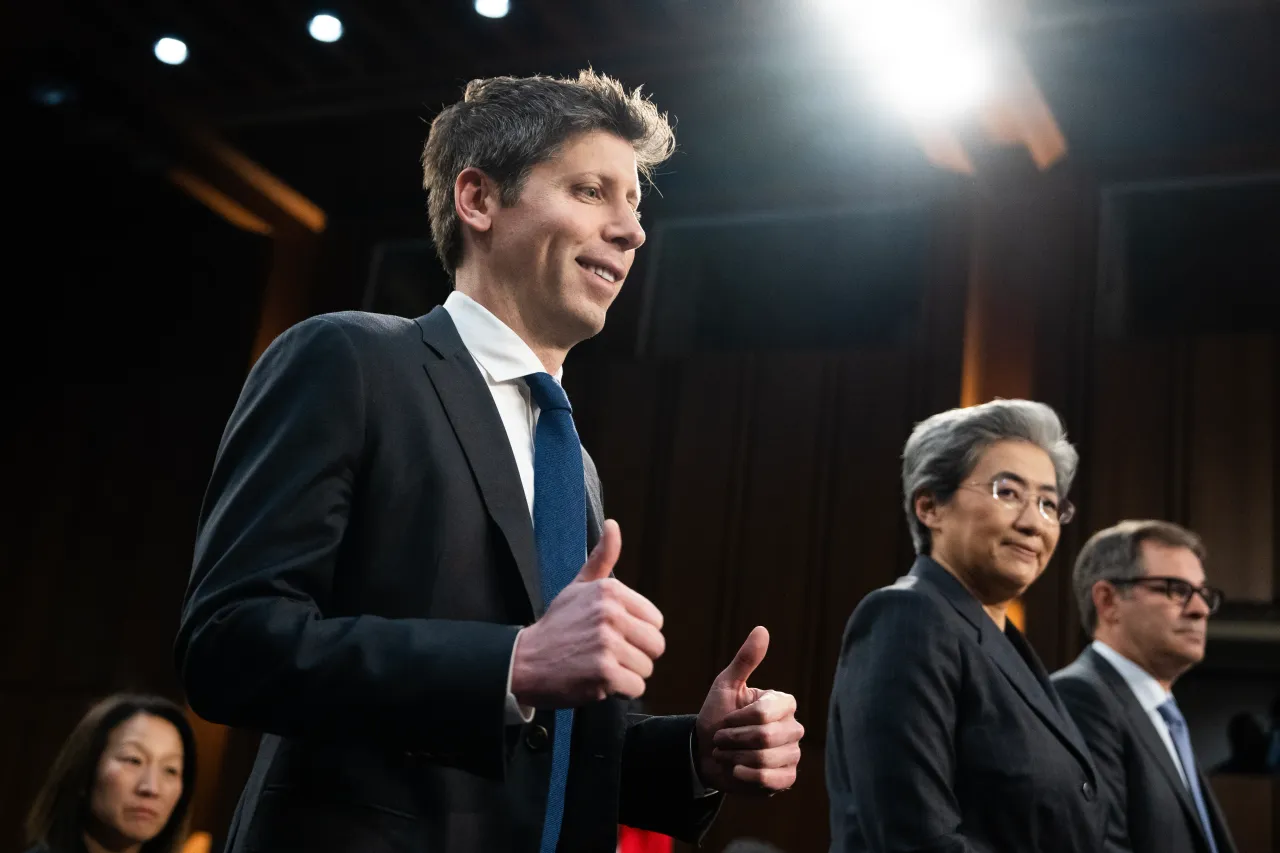 From left, Sam Altman, CEO of OpenAI, Lisa Su, CEO of Advanced Micro Devices, and Michael Intrator, CEO of CoreWeave, arrive to testify at a Senate Committee on Thursday, May 8, 2025. (Tom Williams/CQ-Roll Call, Inc via Getty Images)