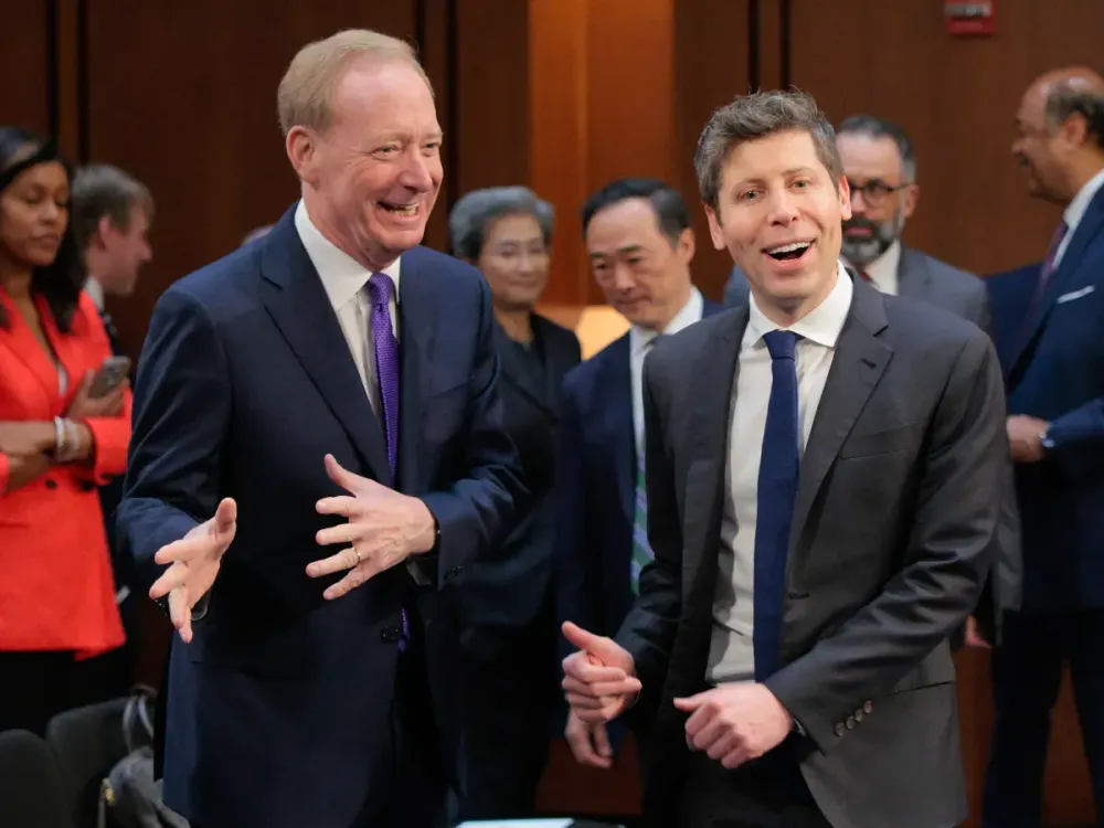 Microsoft Corporation President Brad Smith and OpenAI CEO Sam Altman, arrive to testify before the Senate Committee on Capitol Hill on May 08, 2025 in Washington, DC.  (Photo by Chip Somodevilla/Getty Images)