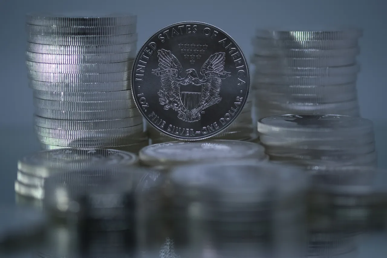 In this photo illustration, one-ounce American Silver Eagle bullion coin is placed among one-ounce silver bullion coins