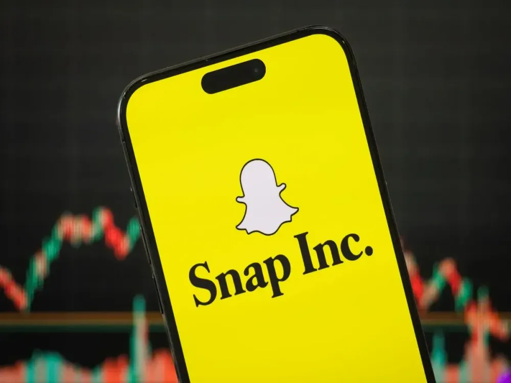 In this photo illustration, the logo of Snap Inc. is displayed on a smartphone screen.
