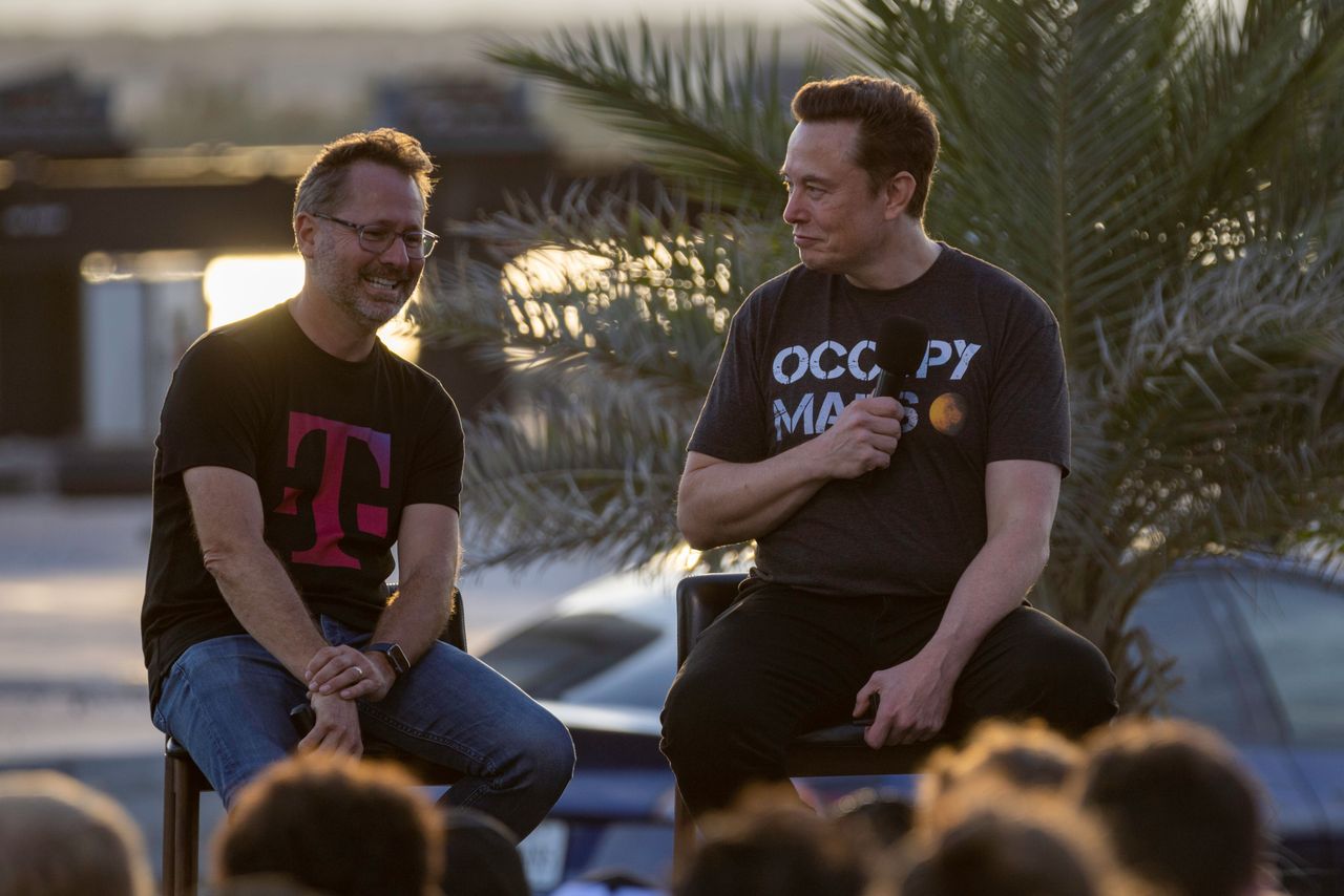 SpaceX founder Elon Musk and T-Mobile CEO Mike Sievert on stage during a T-Mobile and SpaceX joint event on August 25, 2022 in Boca Chica Beach, Texas. (Photo by Michael Gonzalez/Getty Images)
