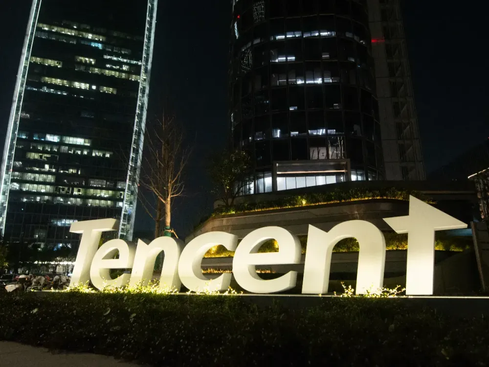 A general view of Tencent headquarters is illuminated in Shanghai, China, on April 9, 2025. (Photo by Ying Tang/NurPhoto via Getty Images)