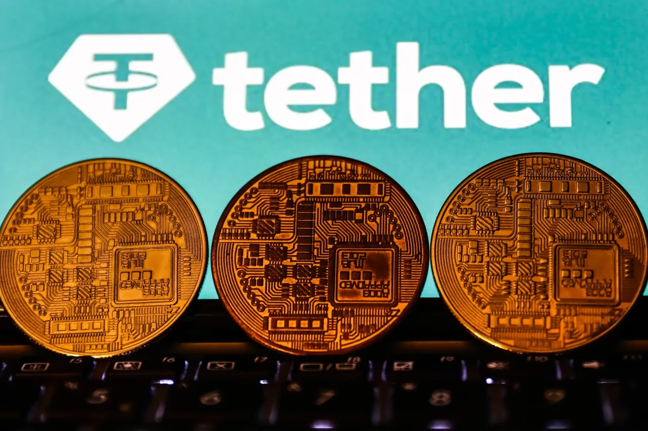 Tether cryptocurrency logo displayed on a phone screen and representation of cryptocurrency are seen in this illustration photo taken in Krakow, Poland on November 2, 2021. (Photo by Jakub Porzycki/NurPhoto via Getty Images)