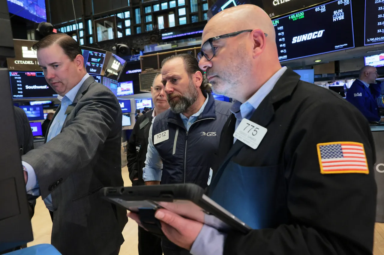 Traders work on the floor of the New York Stock Exchange during morning trading on April 13, 2026 in New York City. (Photo by Michael M. Santiago/Getty Images)