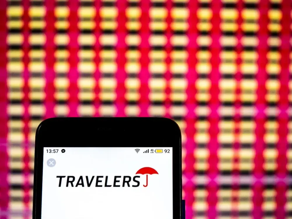 In this photo illustration, the Travelers Companies Insurance company logo seen displayed on a smartphone. (Photo Illustration by Igor Golovniov/SOPA Images/LightRocket via Getty Images)