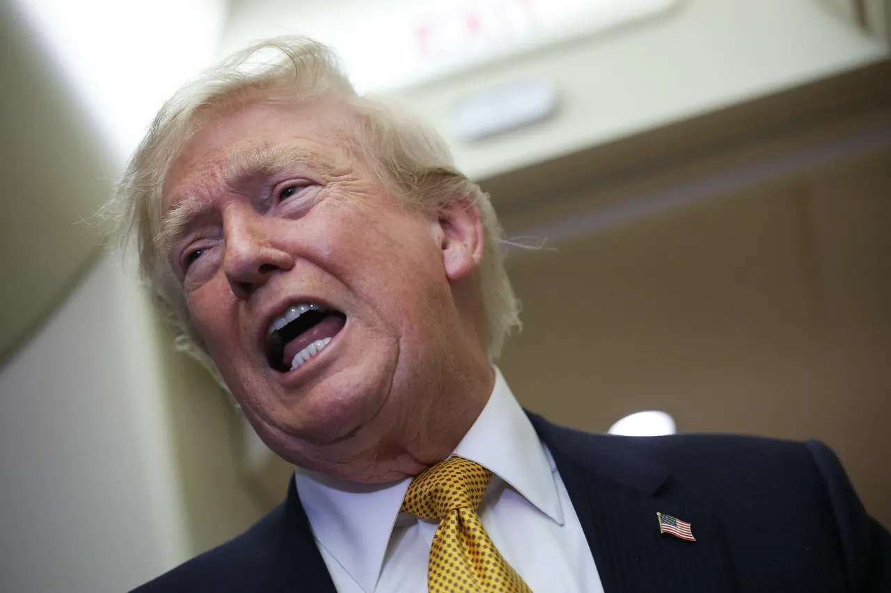 U.S. President Donald Trump speaks to members of the press aboard the new Air Force One on July 8, 2026 after leaving the United Kingdom. (Photo by Win McNamee/Getty Images)