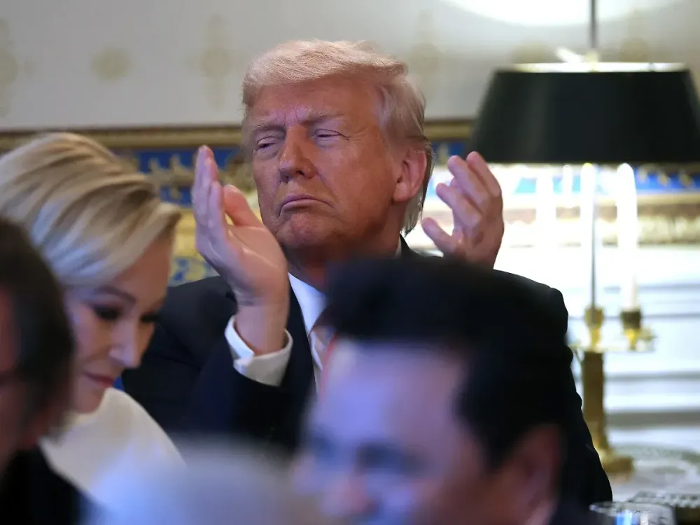 U.S. President Donald Trump applaud before he delivers remarks during an Easter Prayer Service and Dinner in the Blue Room of the White House on April 16, 2025 in Washington, DC. (Photo by Win McNamee/Getty Images)