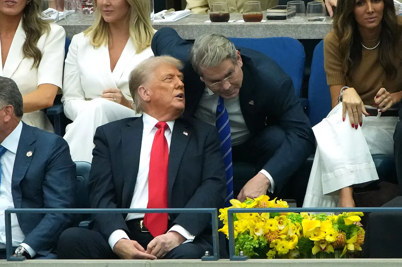 U.S. President Donald Trump speaks to U.S. Treasury Secretary Scott Bessent (R) while watching the men's singles finals at the Billie Jean King National Tennis Center for the U.S. (Photo by Kevin Dietsch/Getty Images)