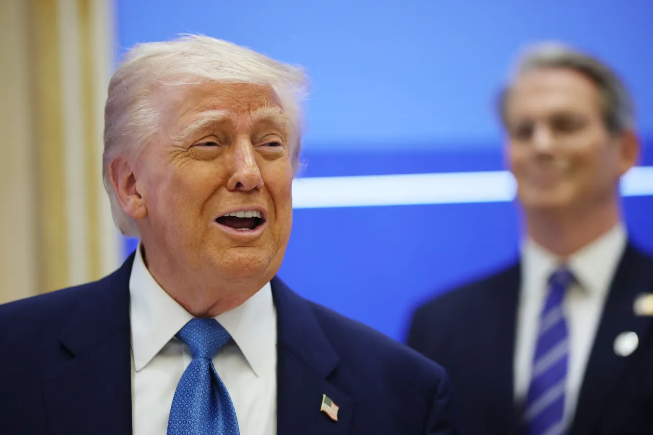U.S. President Donald J. Trump speaks during a US-UAE Investment Forum alongside U.S. Secretary of the Treasury, Scott Bessent (R) on May 16, 2025, in Abu Dhabi, United Arab Emirates. (Photo by Win McNamee/Getty Images)