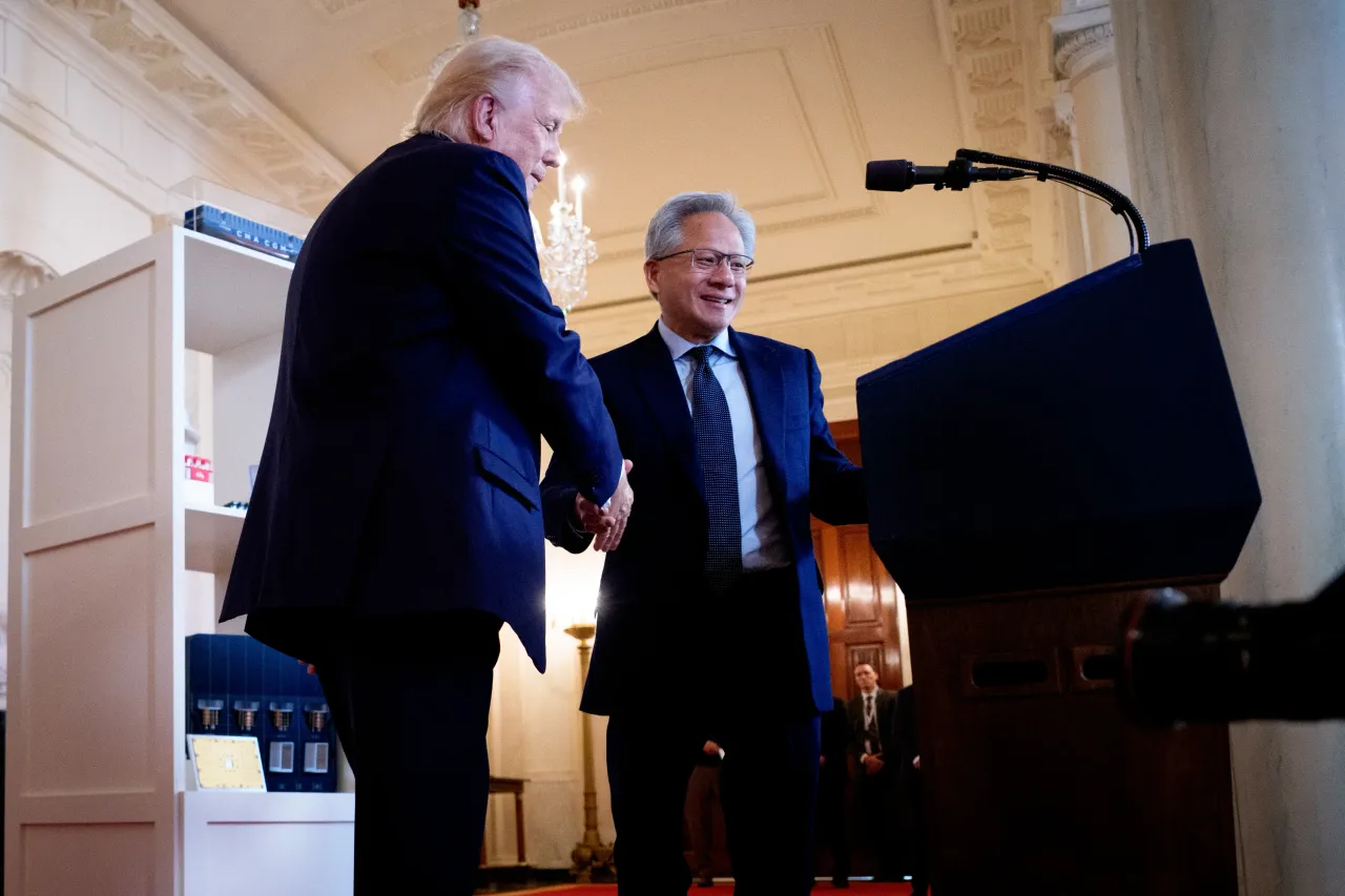 U.S. President Donald Trump (L) invites Nvidia CEO Jensen Huang to speak in the Cross Hall of the White House during an event on "Investing in America" on April 30, 2025 in Washington, DC. (Photo by Andrew Harnik/Getty Images)