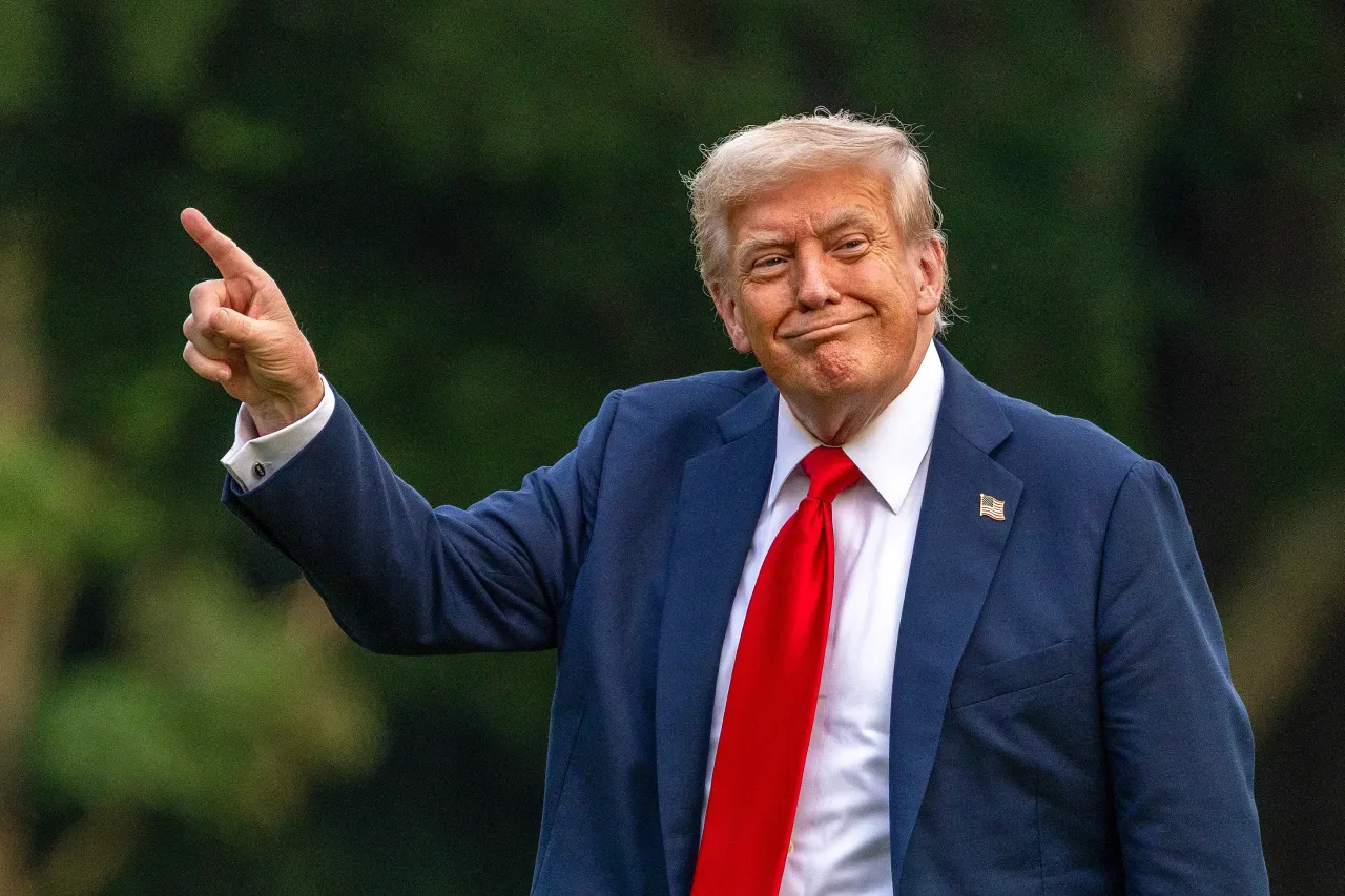 U.S. President Donald Trump walks on the south lawn of the White House and points up at the new flag on July 13, 2025 in Washington, DC. (Photo by Tasos Katopodis/Getty Images)