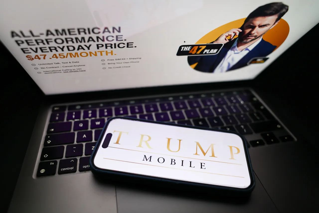 Trump Mobile website displayed on a laptop screen and Trump Mobile logo displayed on a phone screen are seen in this illustration photo taken in Krakow, Poland on June 16, 2025. (Photo by Jakub Porzycki/NurPhoto via Getty Images)
