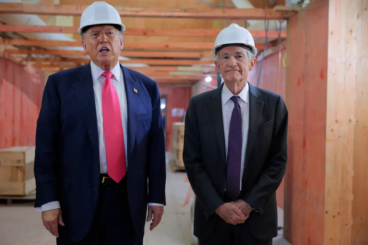 U.S. President Donald Trump and Federal Reserve Chair Jerome Powell talk to reporters while touring the Federal Reserve’s $2.5 billion headquarters renovation project on July 24, 2025 in Washington, DC. (Photo by Chip Somodevilla/Getty Images)