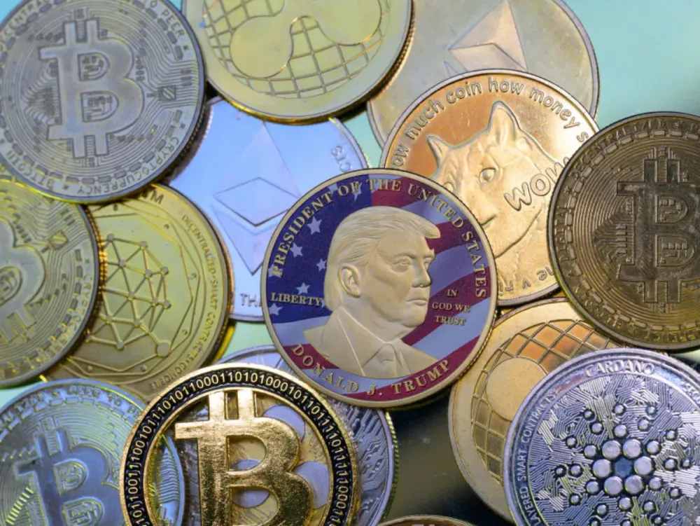 This photo illustration shows a representation of cryptocracy coins with the Official Trump meme coin (collection coin) in Brussels, Belgium, on March 3, 2025. (Photo by Jonathan Raa/NurPhoto via Getty Images)