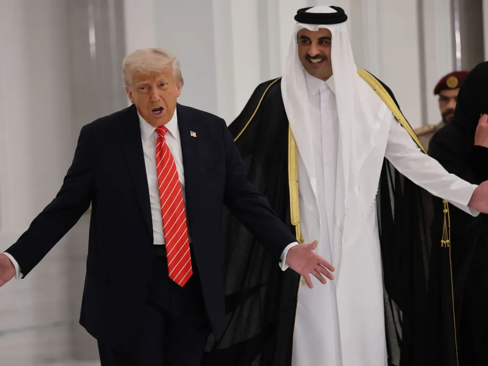 U.S. President Donald J. Trump and Emir of Qatar Tamim bin Hamad al Thani arrive for a state dinner at the Lusail Palace on May 14, 2025, in Doha, Qatar. (Photo by Win McNamee/Getty Images)