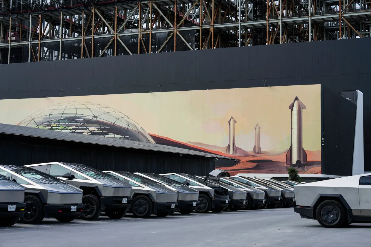 A line of Cybertrucks are parked near the A Space X rocket assembly facility under construction in Star Base, Wednesday, June 3, 2026. (Brett Coomer/Houston Chronicle via Getty Images)