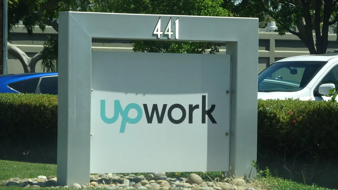 Close-up of sign at entrance to Silicon Valley headquarters of outsourcing and freelancing company Upwork, Mountain View, California