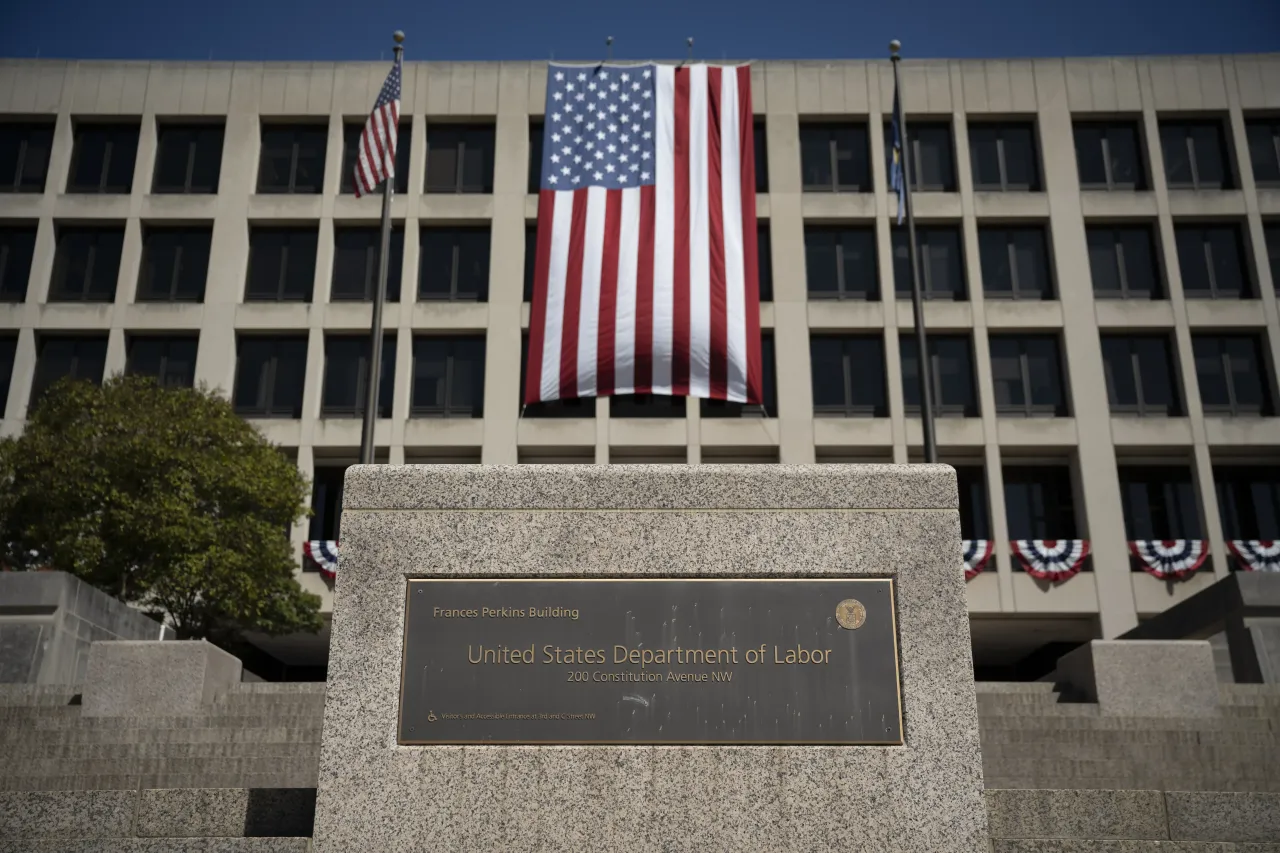A large US flag is seen on the facade of the Department of Labor headquarters building in Washington DC, United States on September 8, 2025