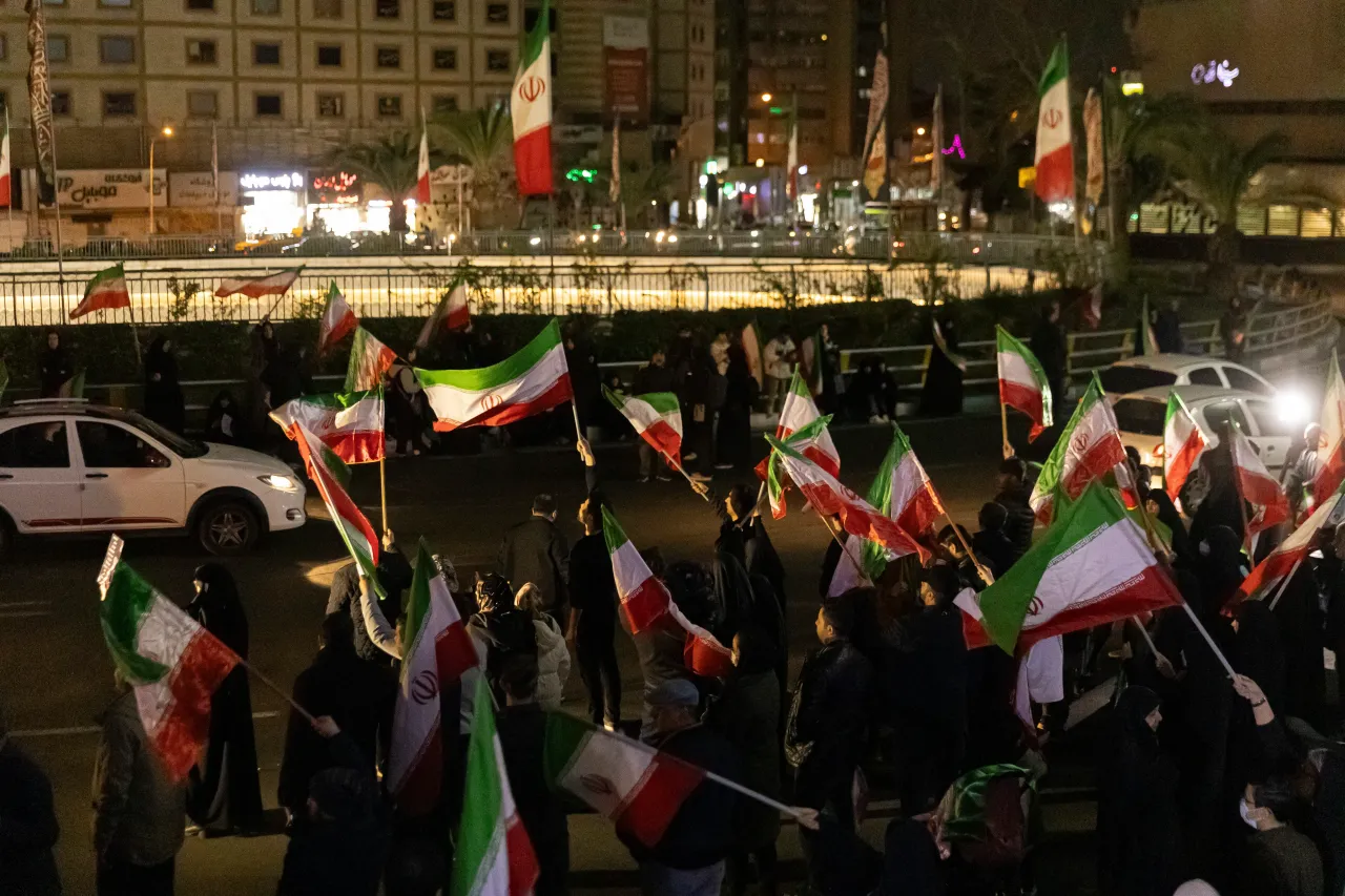 Mourners gather with Iranian national flags for a memorial vigil after Iranian state media confirmed the death of Ayatollah Ali Khamenei on March 1, 2026 in Tehran, Iran. (Photo by Majid Saeedi/Getty Images)