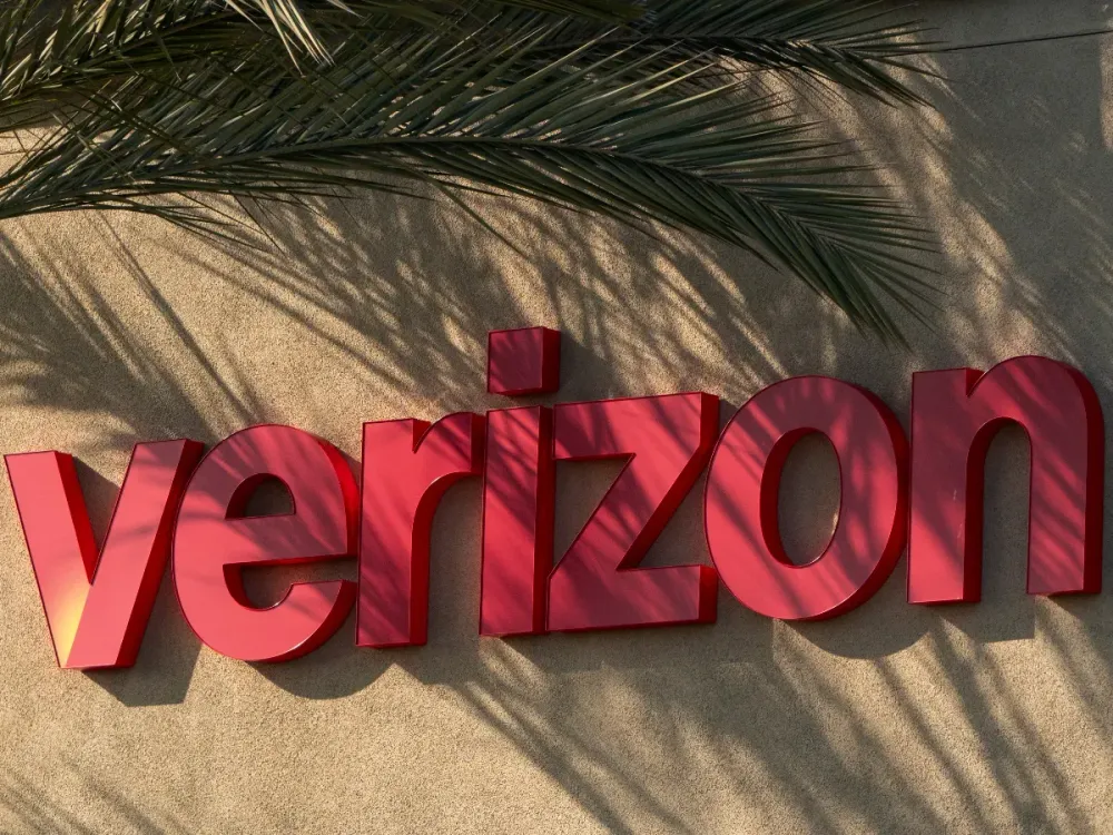 The Verizon corporate logo is displayed on a sign at their store on January 31, 2025 in San Diego, California. (Photo by Kevin Carter/Getty Images)