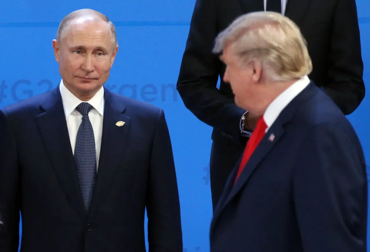 U.S. President Donald Trump (R) looks on Russian President Vladimir Putin (L) during the family photo at the G20 Summit's Plenary Meeting in Buenos Aires, Argentina, in 2018