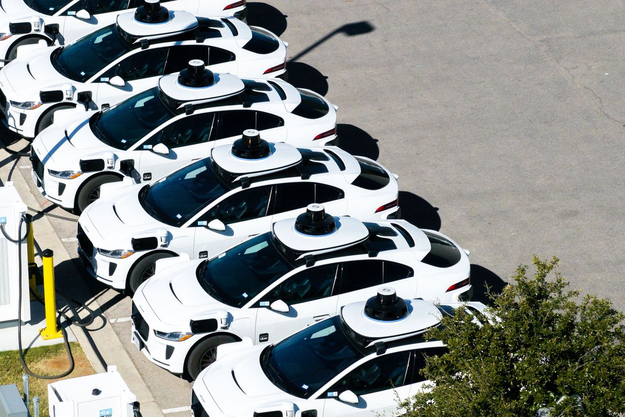 In an aerial view, Waymo vehicles charge at a lot on January 15, 2026 in Austin, Texas. (Photo by Brandon Bell/Getty Images)