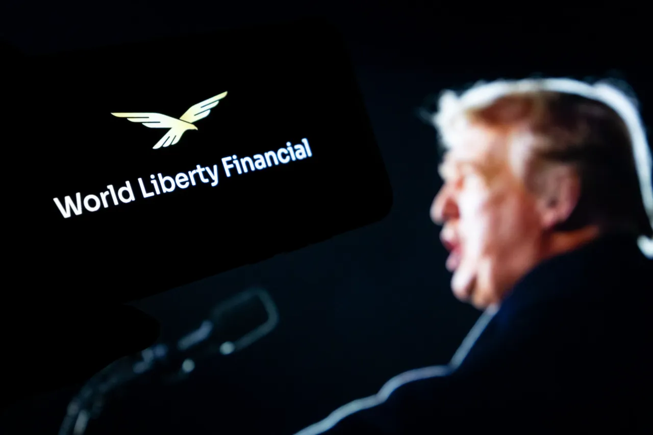In this photo illustration, the logo of World Liberty Financial (WLFI) token is displayed on a smartphone screen on September 7, 2025 in Chongqing, China. (Photo by Li Hongbo/VCG via Getty Images)