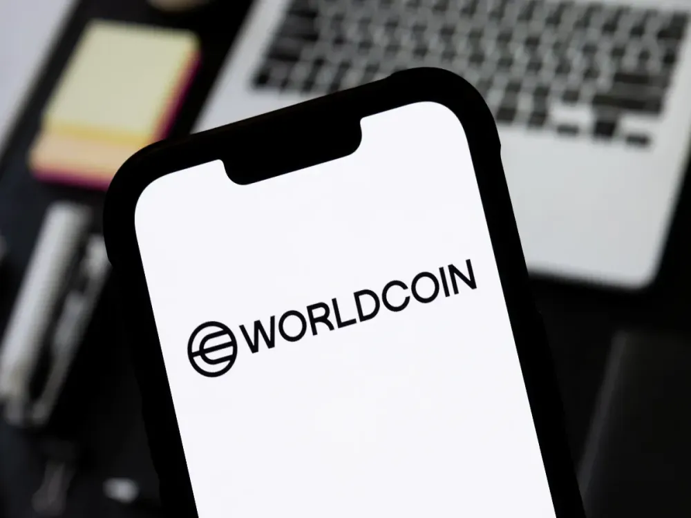 In this photo illustration, a Worldcoin logo is seen displayed on a smartphone. (Photo Illustration by Mateusz Slodkowski/SOPA Images/LightRocket via Getty Images)