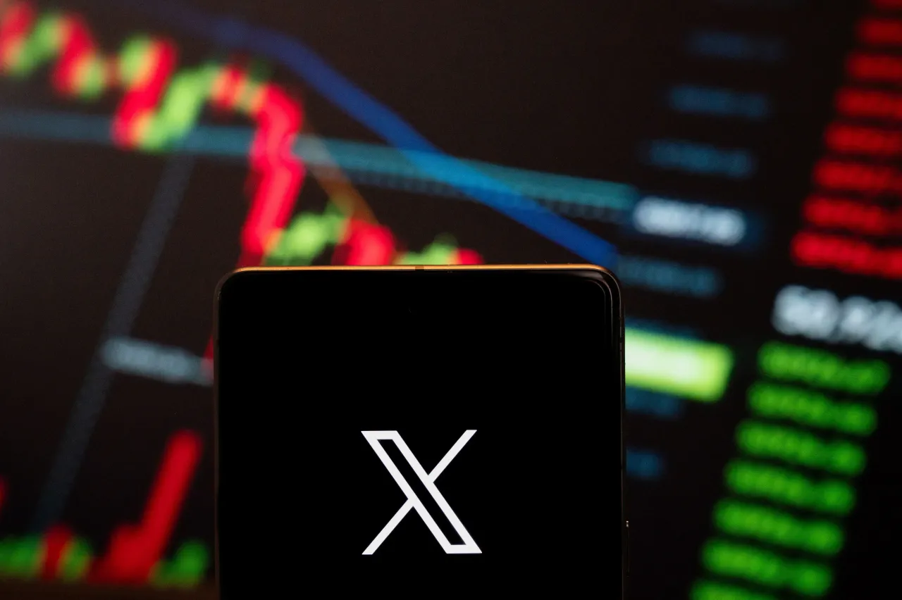 In this photo illustration, social networking service owned by Elon Musk, X Corp, logo seen displayed on a smartphone with a graph in the background. (Photo Illustration by Budrul Chukrut/SOPA Images/LightRocket via Getty Images)