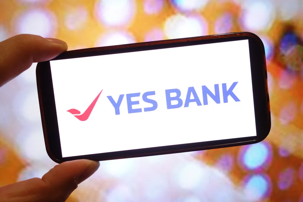 In this photo illustration, the Yes Bank company logo is seen displayed on a smartphone screen. (Photo Illustration by Piotr Swat/SOPA Images/LightRocket via Getty Images)