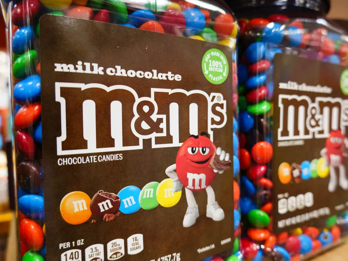 Packages of M&M's chocolate candy are displayed at a Costco Wholesale store on April 27, 2025 in San Diego, California. (Photo by Kevin Carter/Getty Images)