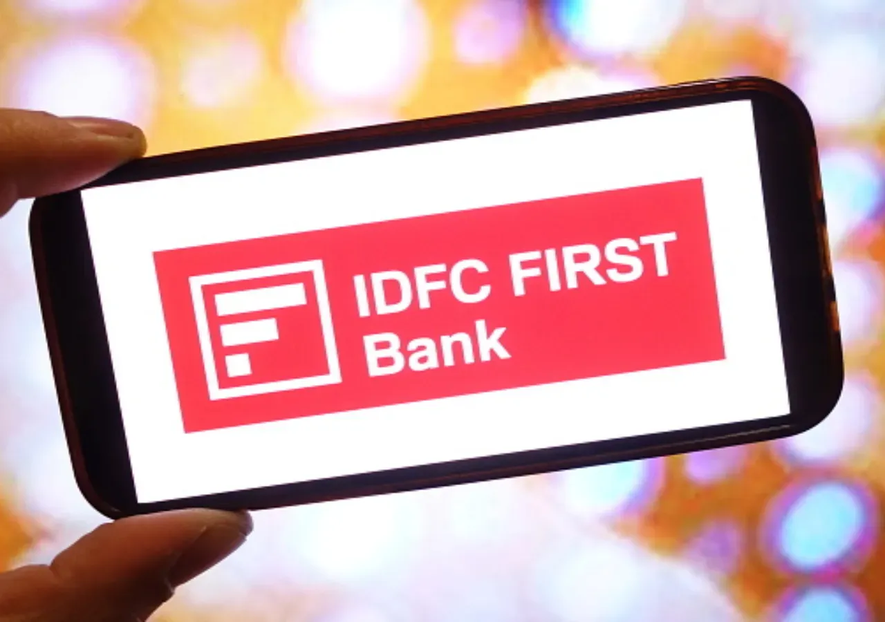 In this photo illustration, the IDFC FIRST Bank company logo is seen displayed on a smartphone screen. (Photo Illustration by Piotr Swat/SOPA Images/LightRocket via Getty Images)