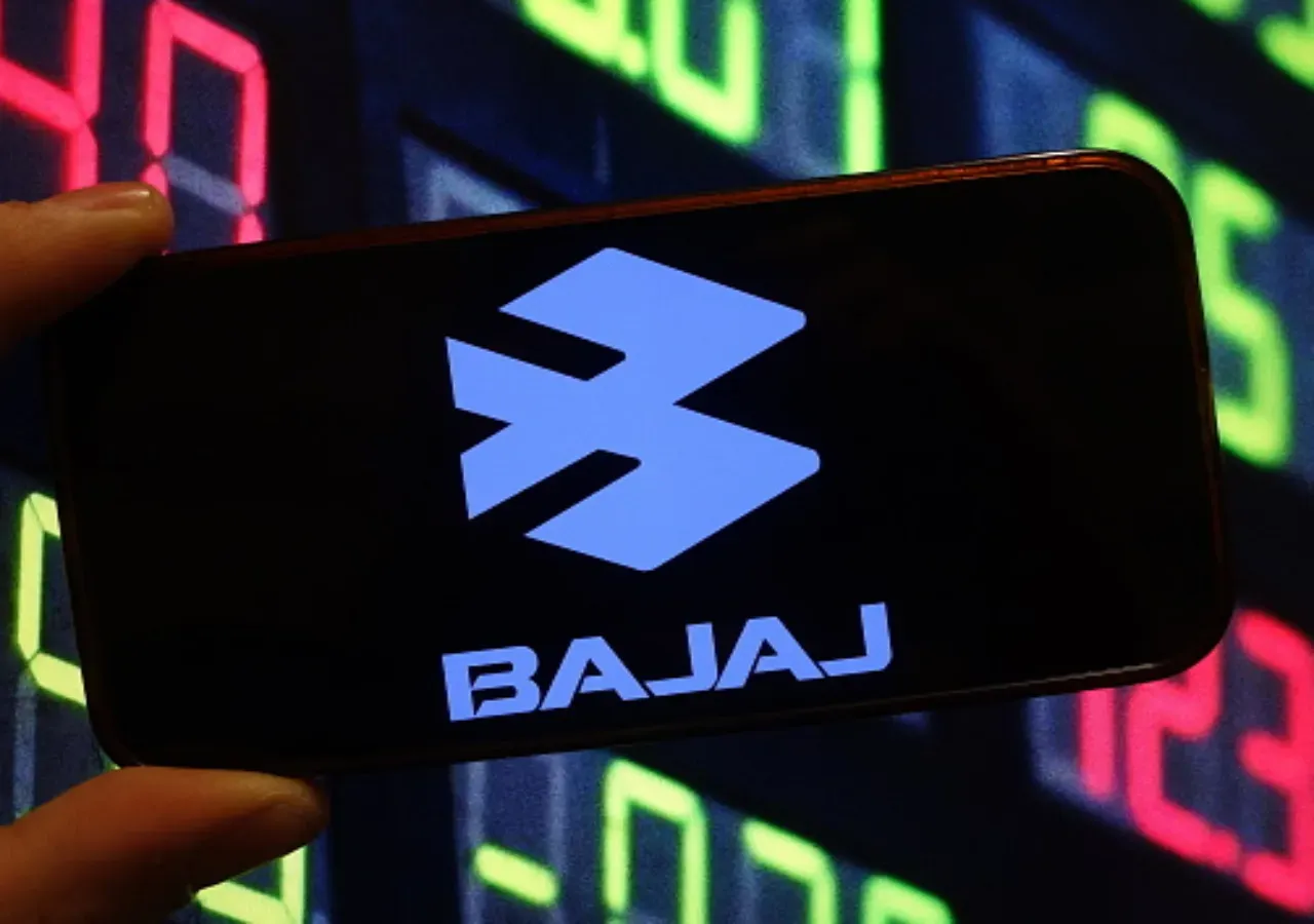 In this photo illustration, the Bajaj Auto company logo is seen displayed on a smartphone screen. (Photo Illustration by Piotr Swat/SOPA Images/LightRocket via Getty Images)