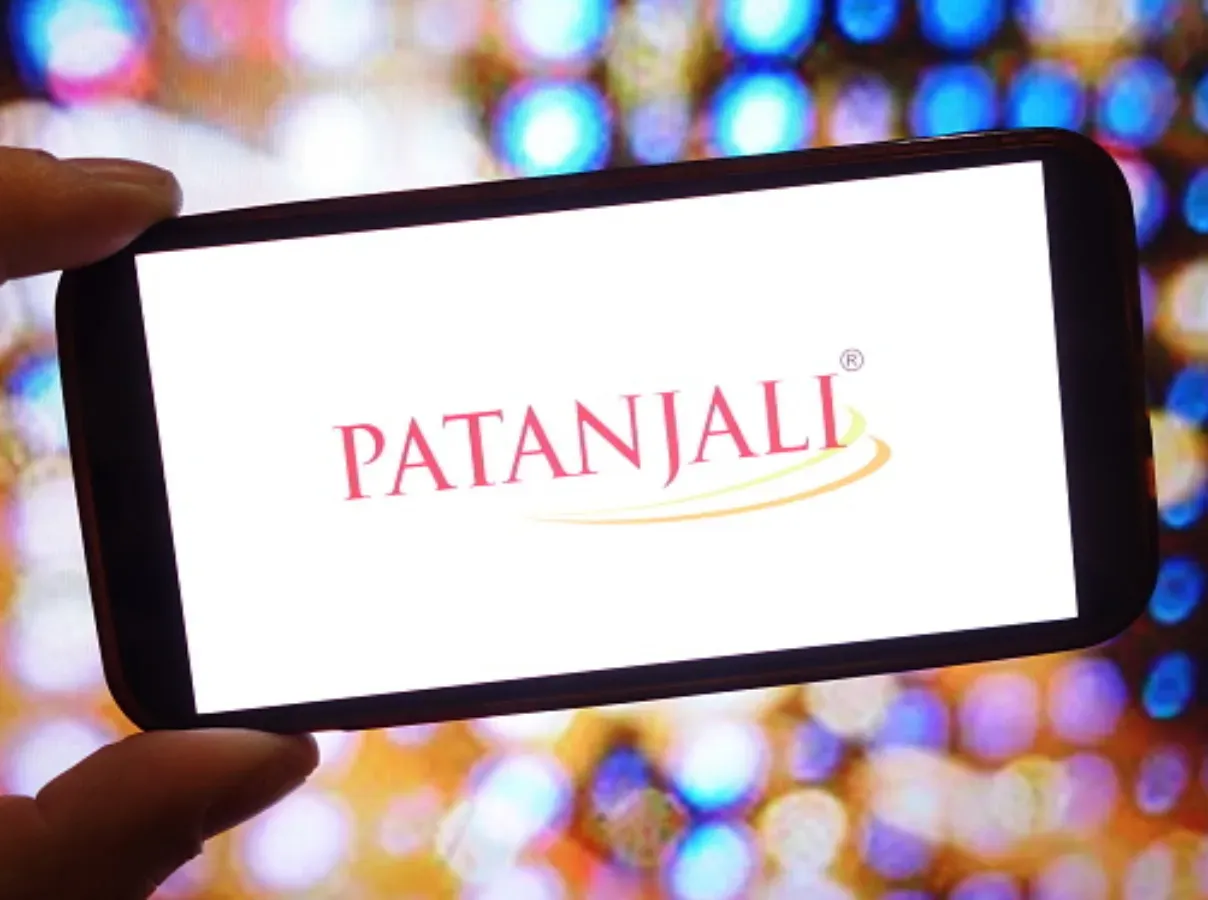 In this photo illustration, the Patanjali Foods company logo is seen displayed on a smartphone screen. (Photo Illustration by Piotr Swat/SOPA Images/LightRocket via Getty Images)