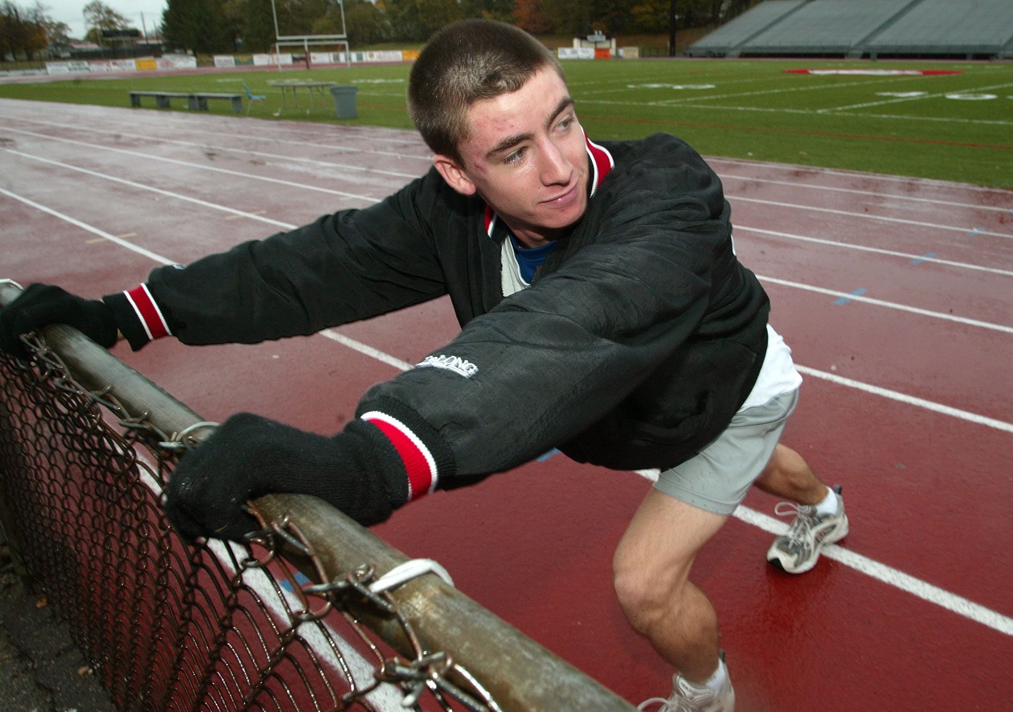 Brockton High cross country runner Keith Gill warming up at Marciano Stadium in Brockton, MA on Oct. 27, 2003. In 2021, he gained fame for driving up the price of Gamestop stock as "The Roaring Kitty." (Photo by Tom Herde/The Boston Globe via Getty Images)