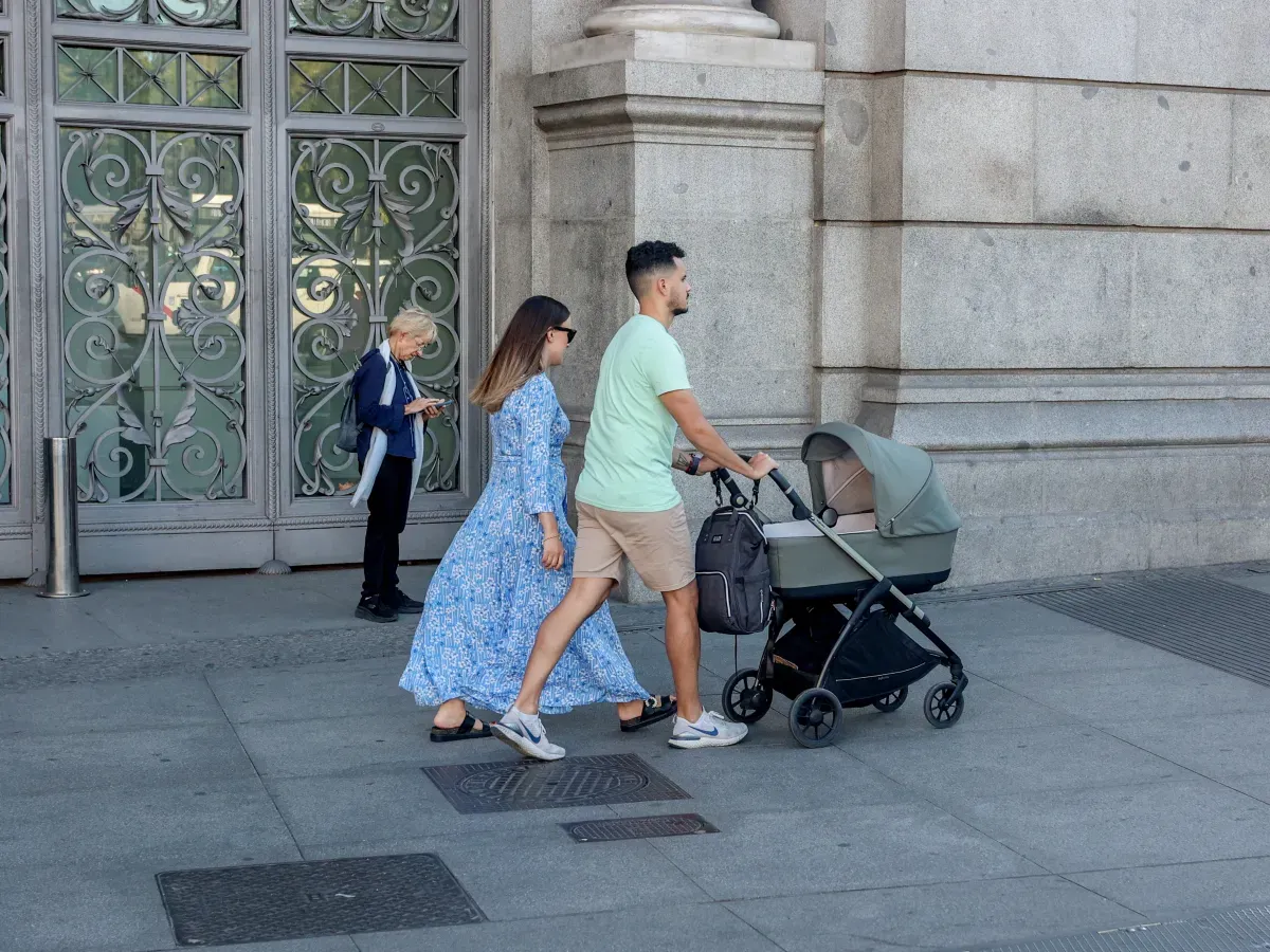 Two people walk with a baby stroller on October 3, 2024, in Madrid, Spain. (Photo By Ricardo Rubio/Europa Press via Getty Images)