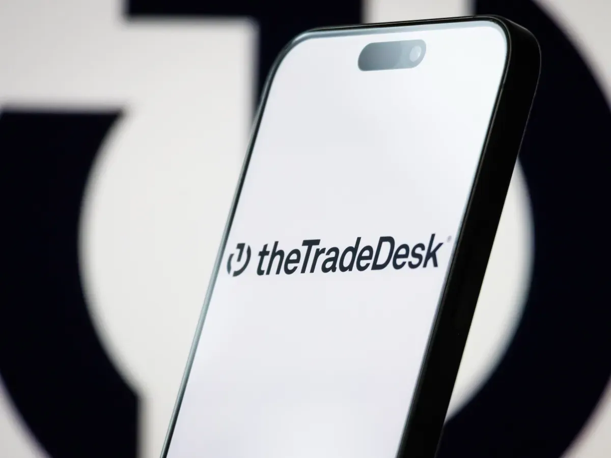 In this photo illustration, the logo of The Trade Desk, Inc. is displayed on a smartphone screen, with the company's branding visible in the background, on May 06, 2025, in Chongqing, China. 