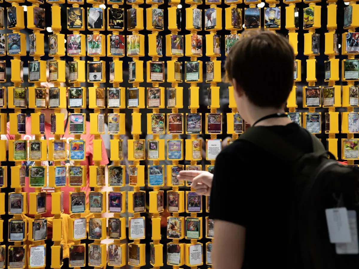 A person looks through trading cards during MCM Comic Con at the ExCel London in east London. Picture date: Friday October 28, 2022. (Photo by James Manning/PA Images via Getty Images)