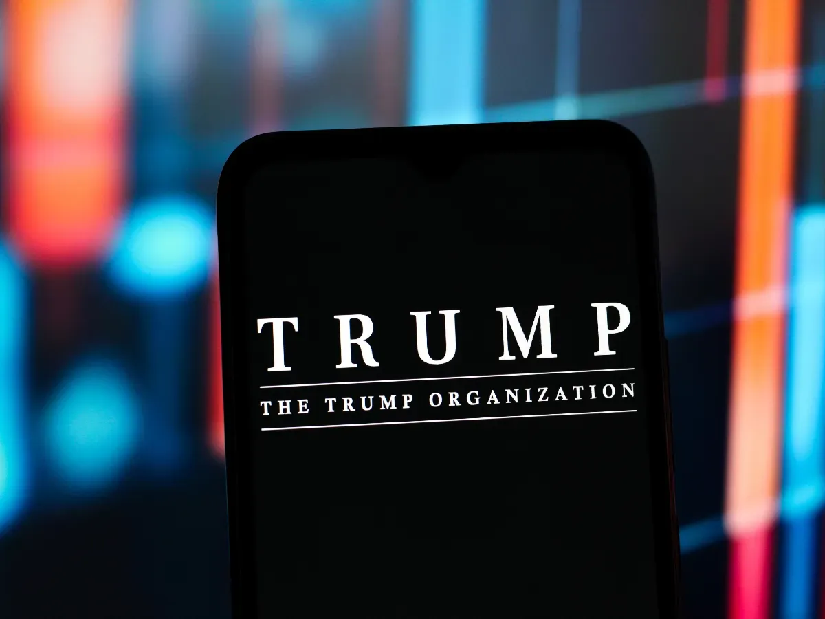 In this photo illustration, the Trump Organization logo is seen displayed on a smartphone screen. (Photo Illustration by Thomas Fuller/SOPA Images/LightRocket via Getty Images)
