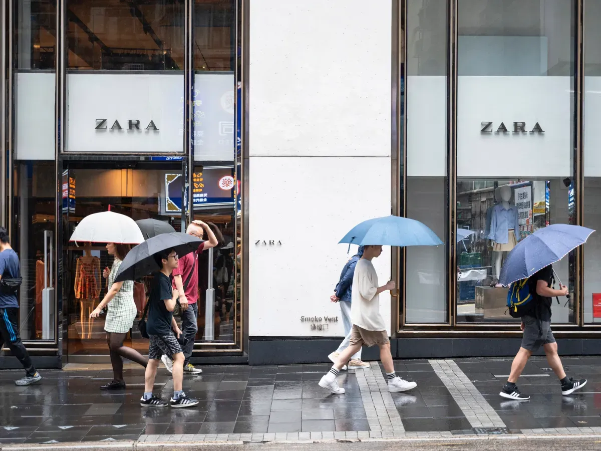 Pedestrians and shoppers walk past a Zara store in Hong Kong. (Photo by Sebastian Ng/SOPA Images/LightRocket via Getty Images)